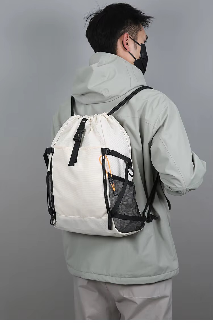 man wearing beige backpack