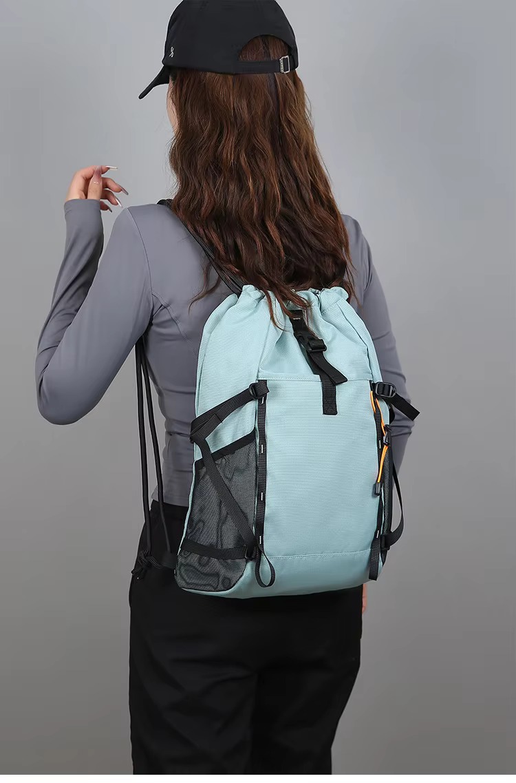 woman wearing green backpack