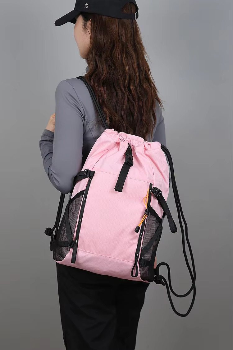 woman wearing pink backpack