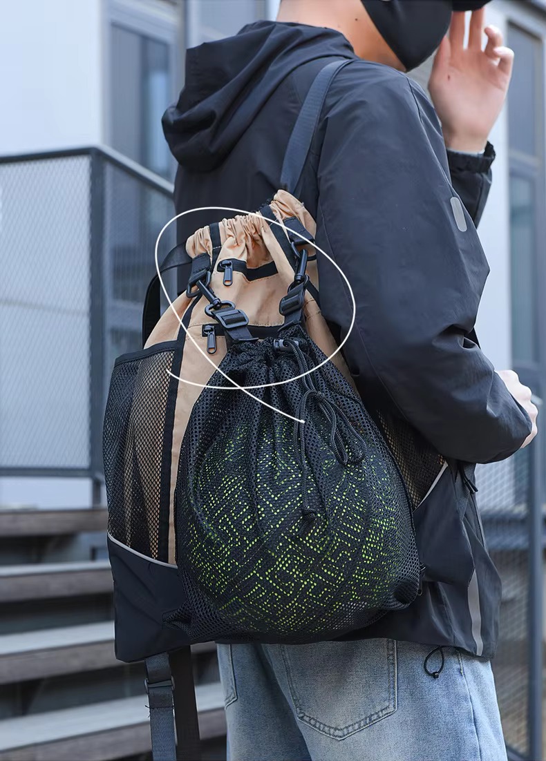 ball net pouch clipped to backpack on model