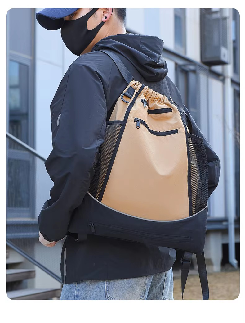 man wearing khaki backpack side view