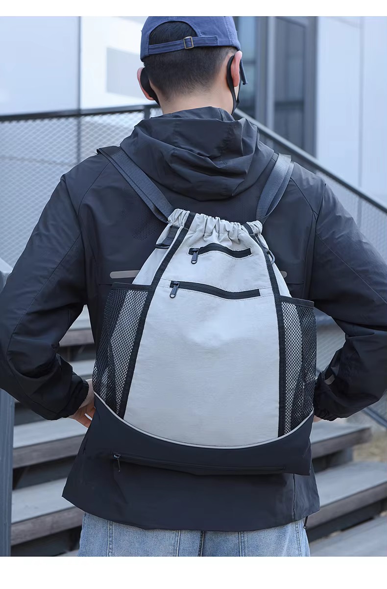 man wearing gray backpack