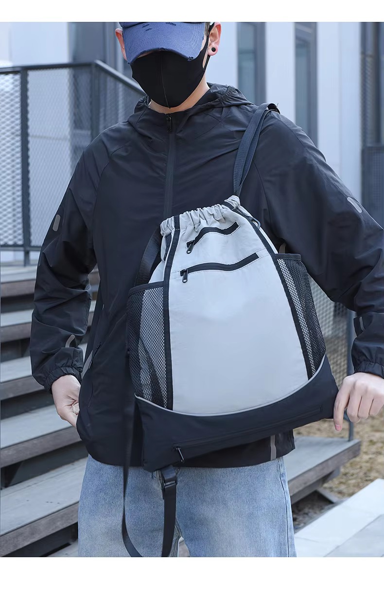 man wearing gray backpack front