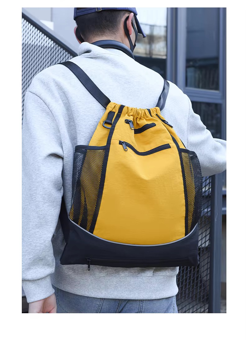man wearing yellow backpack