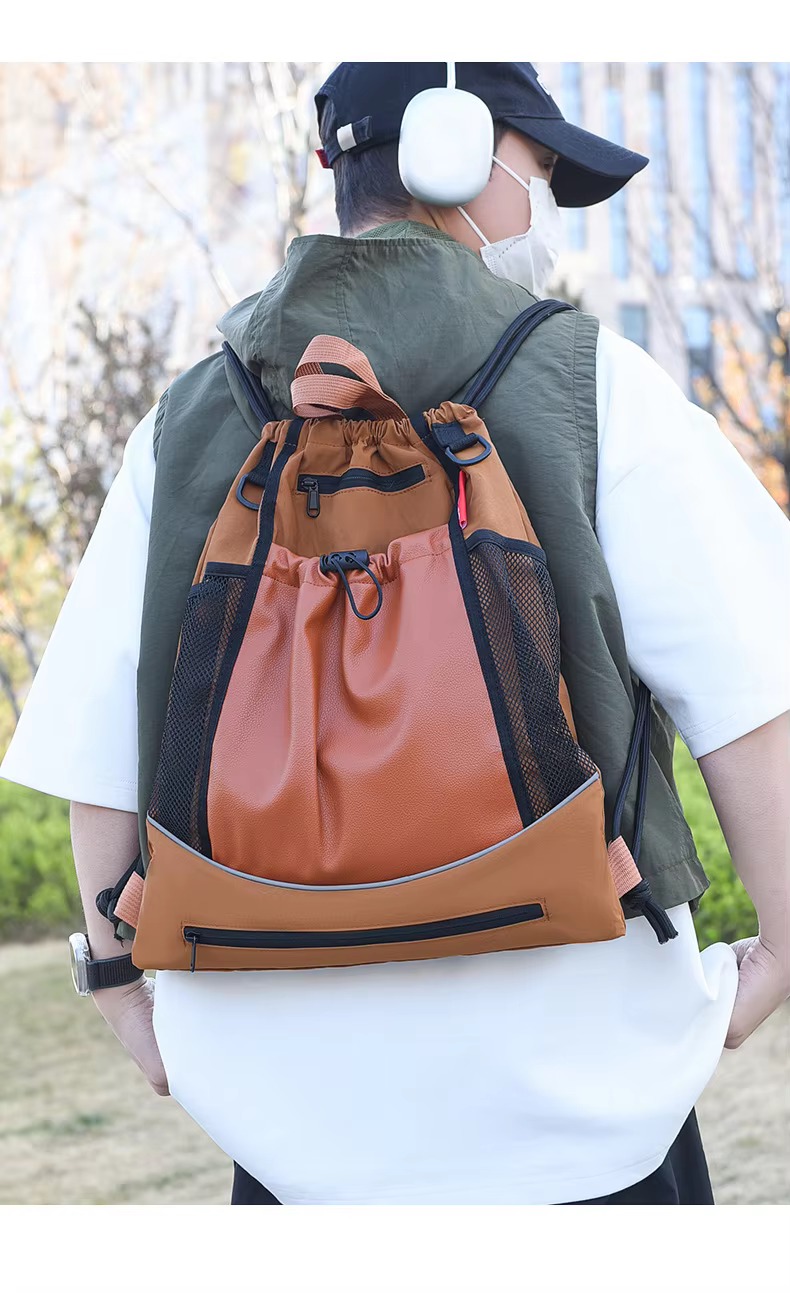 man wearing orange backpack
