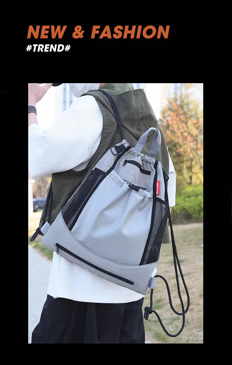 man wearing grey backpack