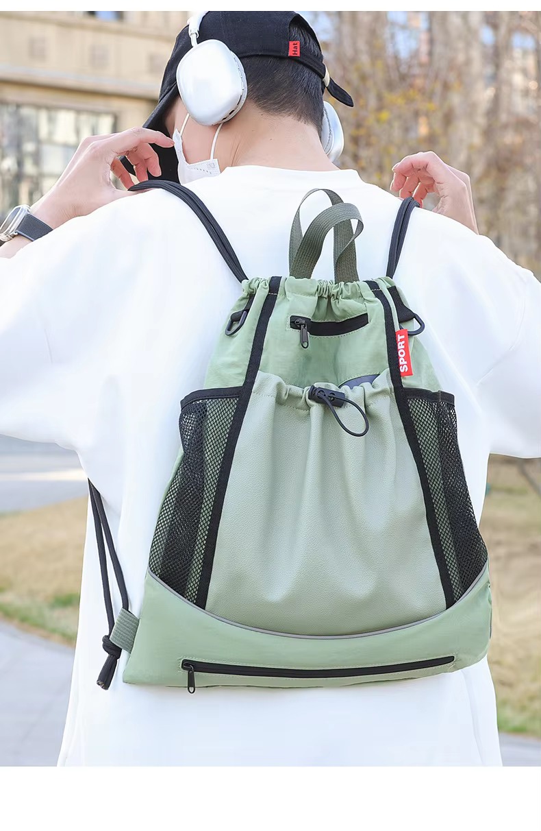 man wearing green backpack