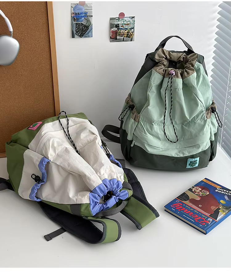 beige and green backpacks lying and standing