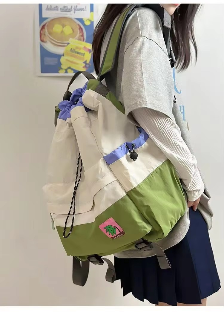 student carrying beige backpack on shoulder