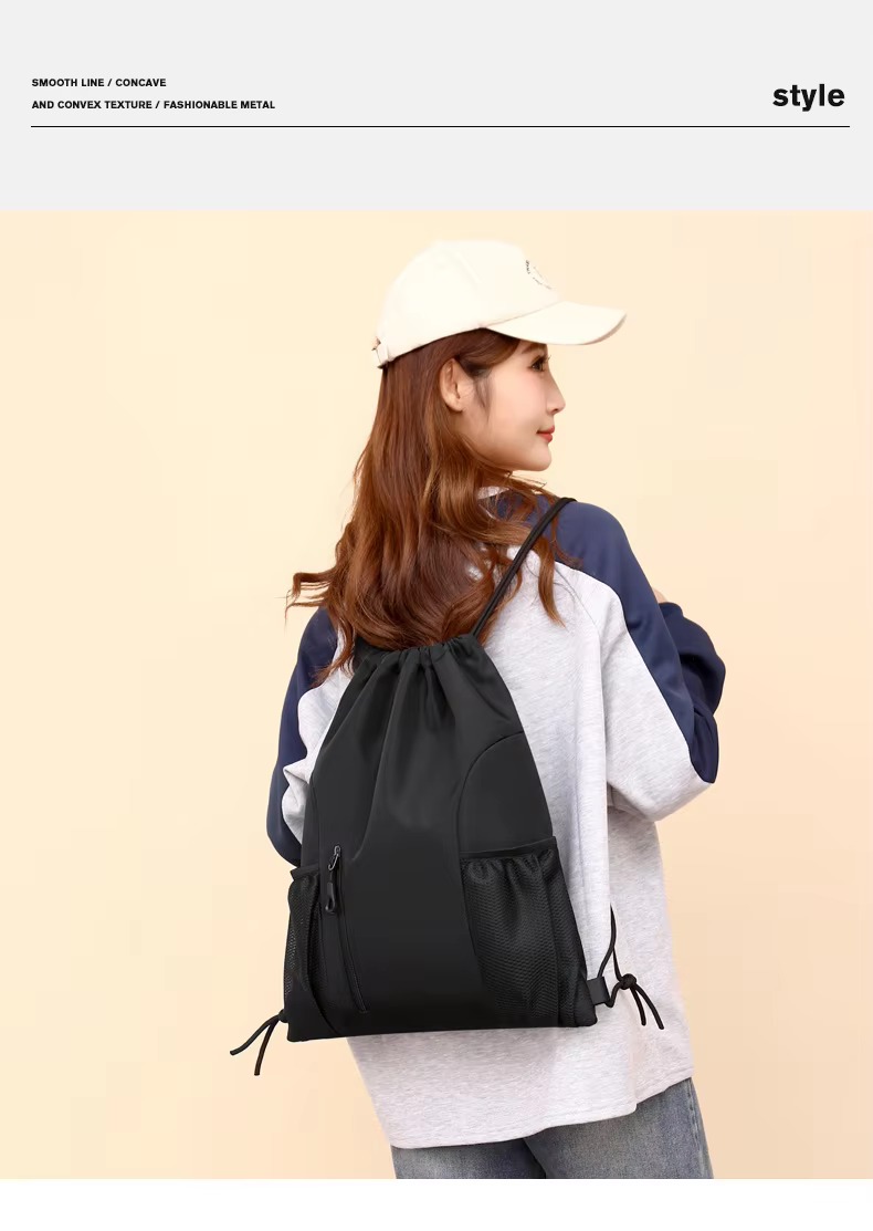 woman wearing black backpack back view