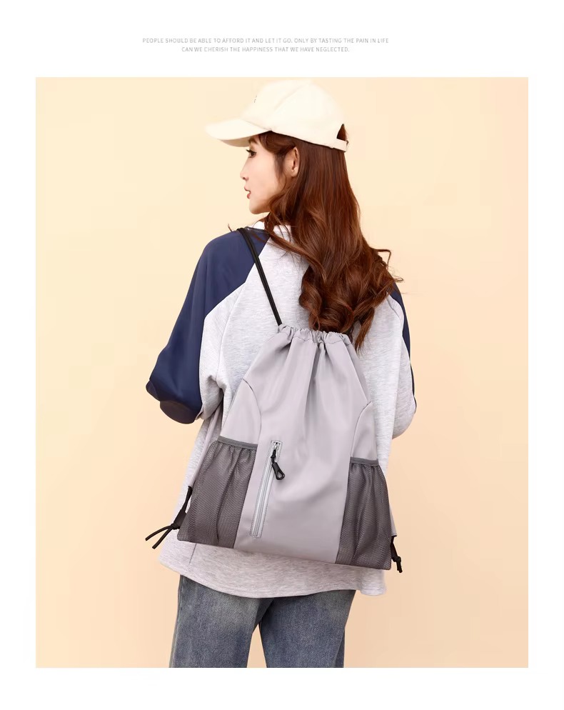 woman wearing gray backpack