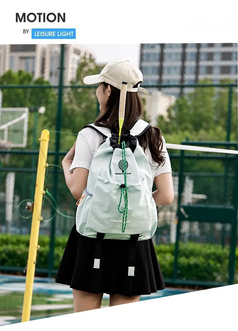 woman wearing light green backpack on badminton court