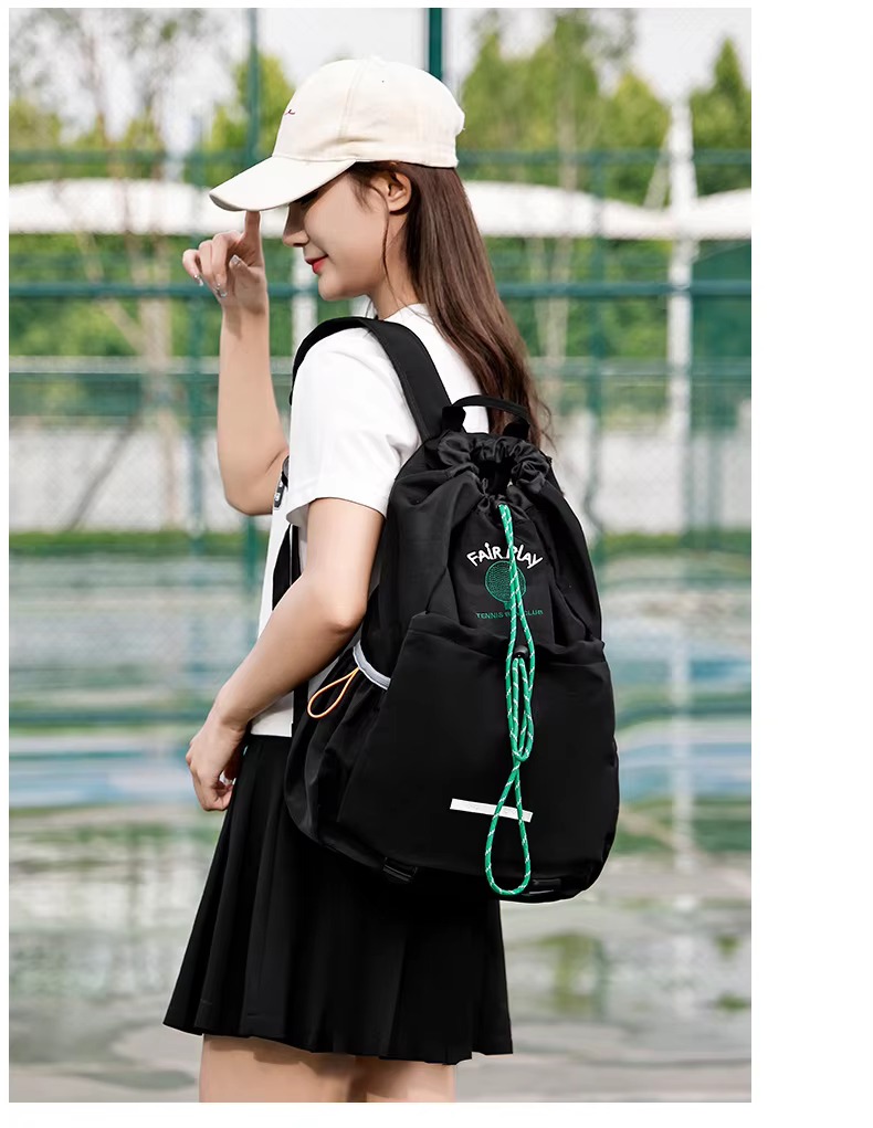 woman wearing black backpack side view