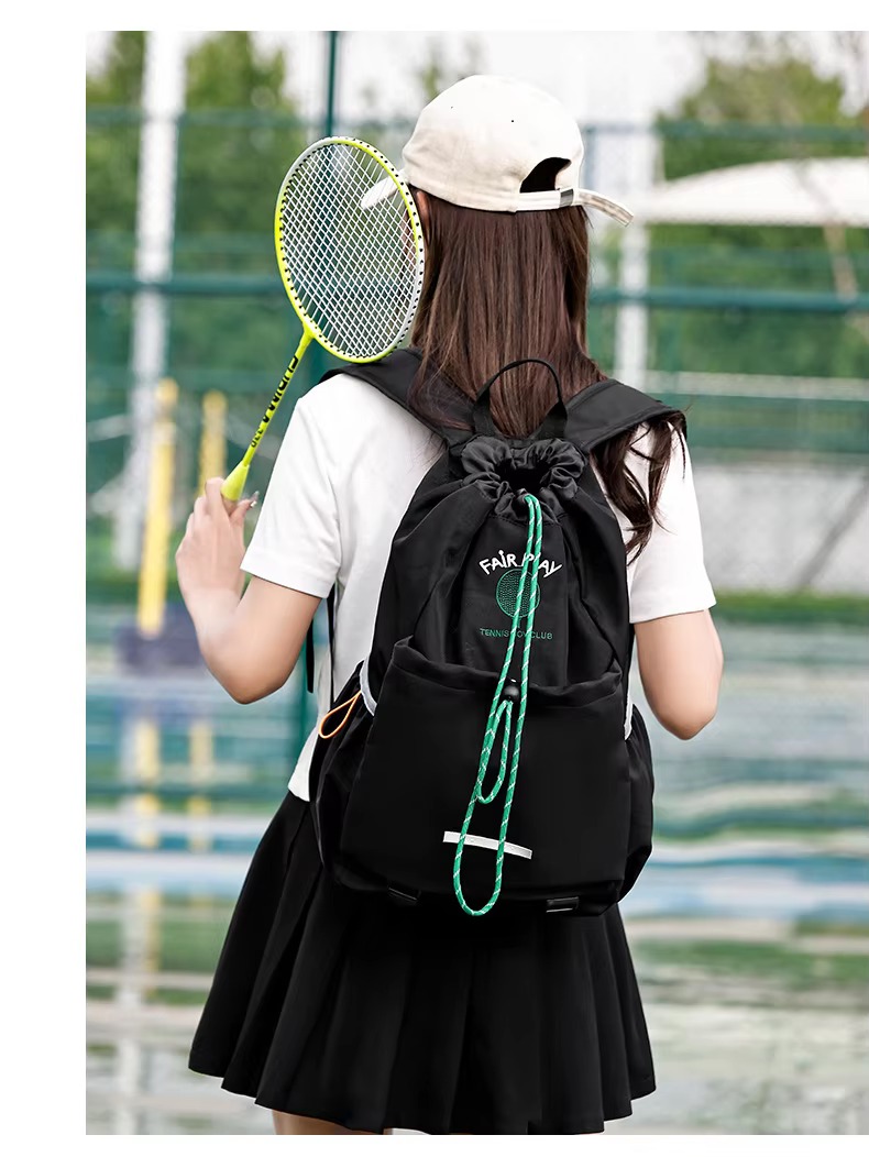 black backpack back view with racket