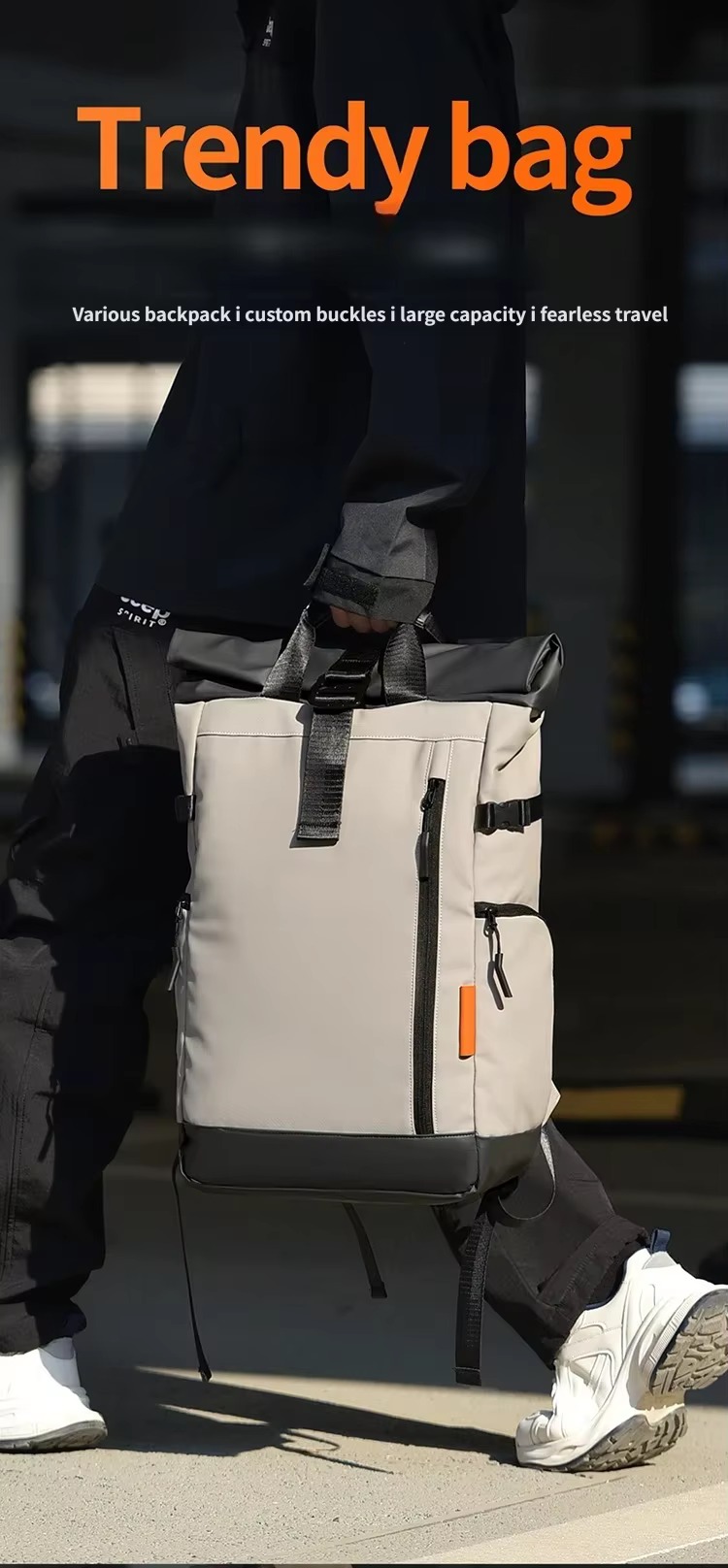 man carrying beige roll top backpack by hand