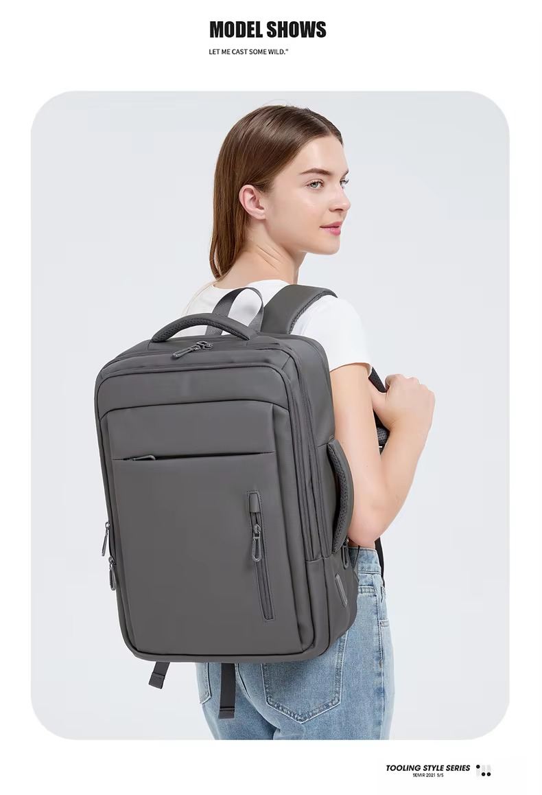 woman wearing grey backpack