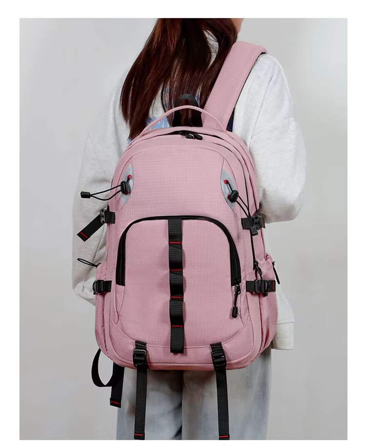 woman wearing pink backpack