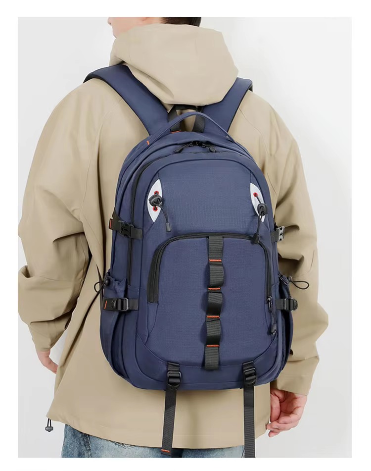 man wearing dark blue backpack