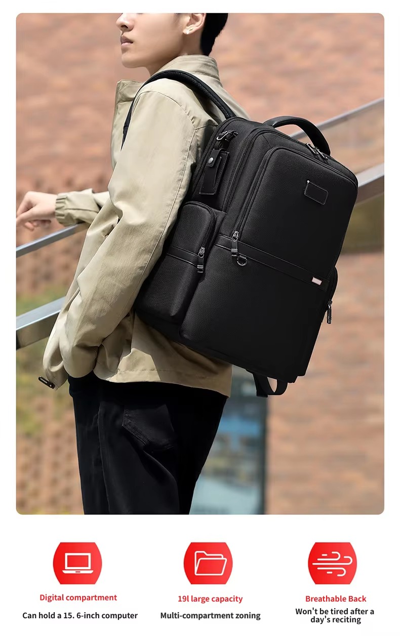 man wearing black business backpack