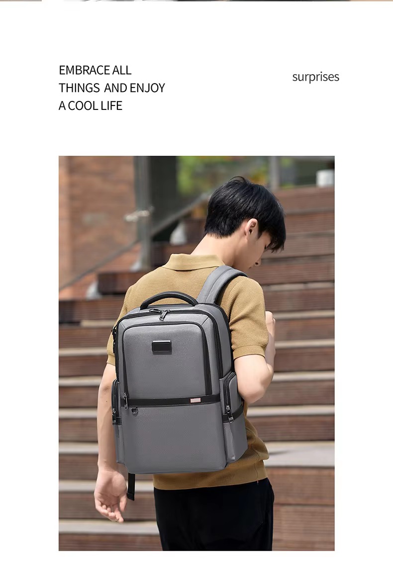 man wearing gray backpack on stairs