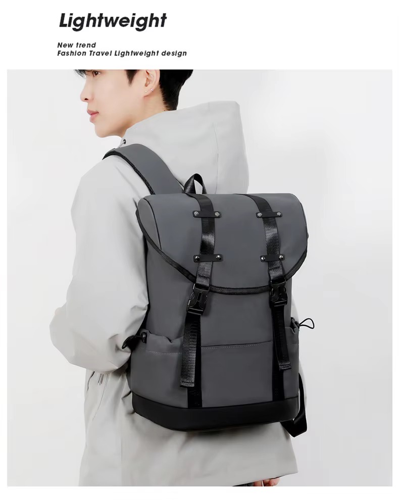 man wearing gray backpack side view
