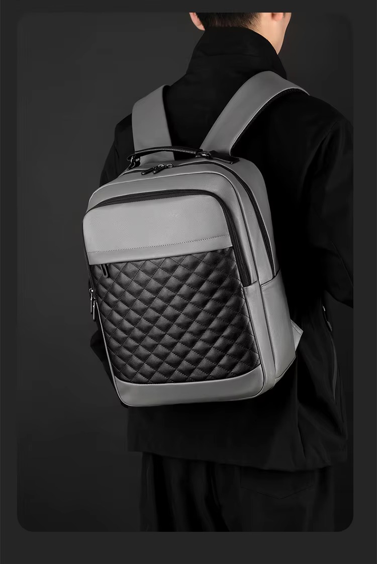 man wearing gray quilted backpack