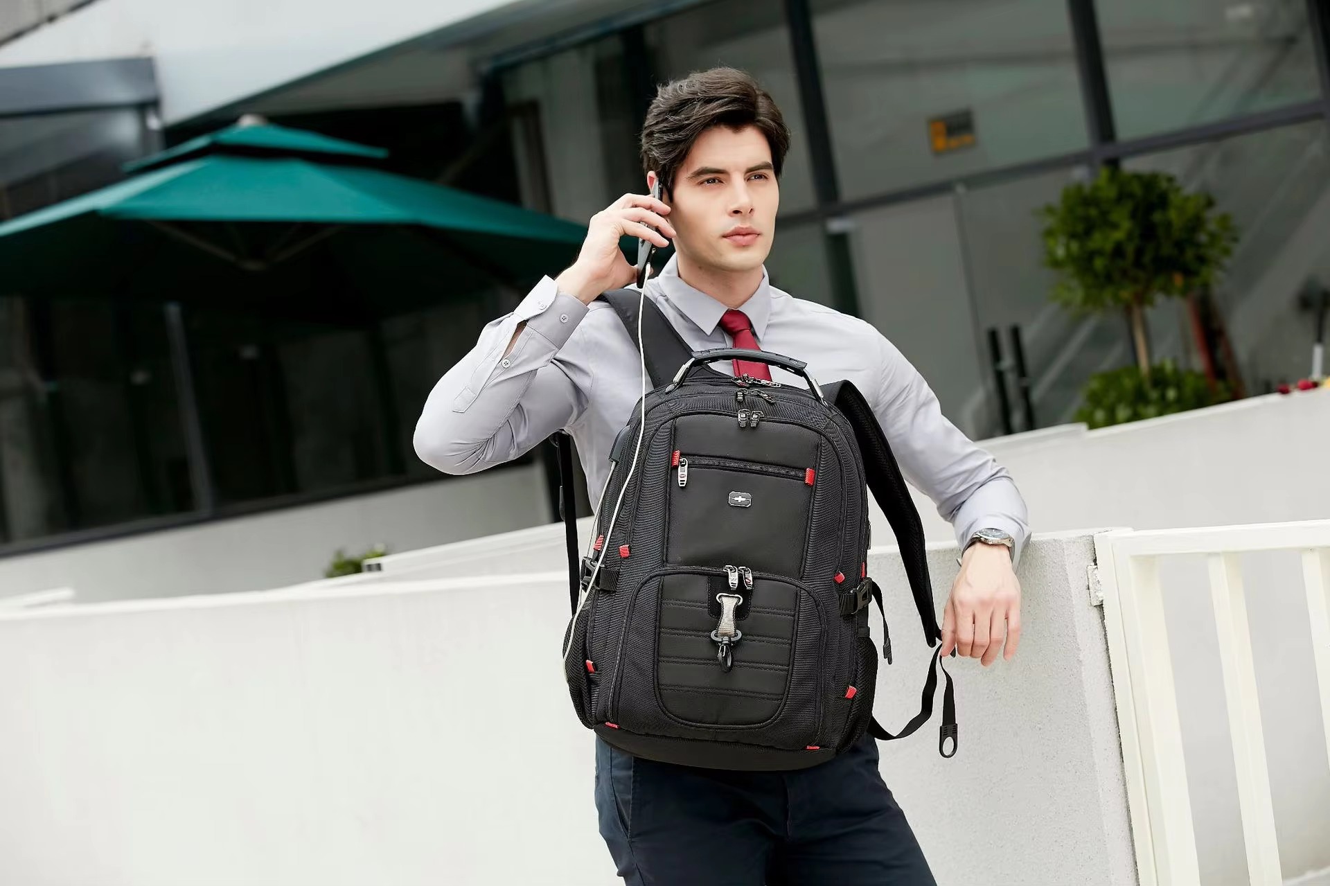 man on phone with backpack