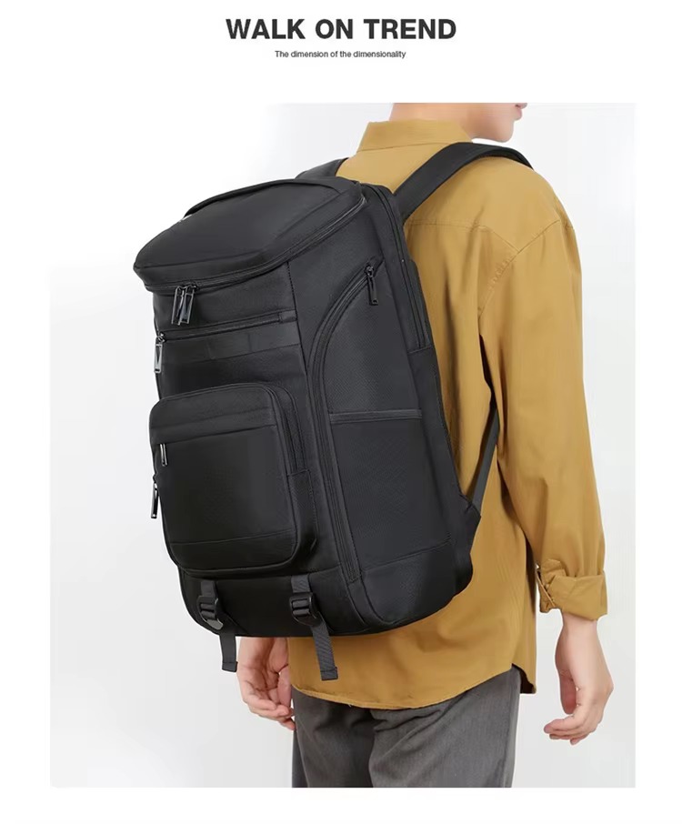 man wearing black backpack three-quarter view