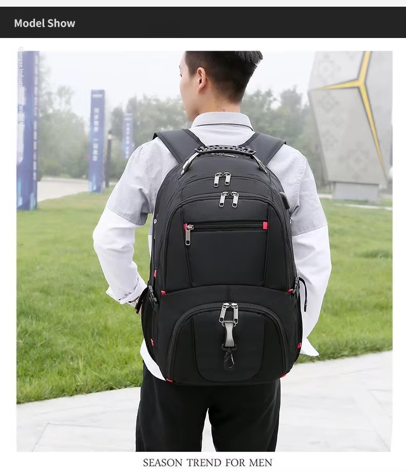 man wearing black backpack outdoors on campus path