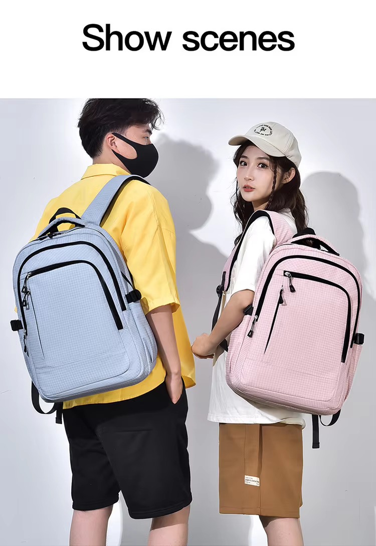 couple wearing blue and pink backpacks