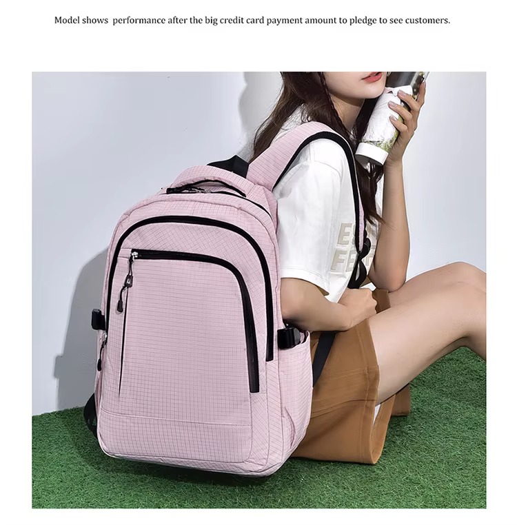 woman sitting with pink backpack