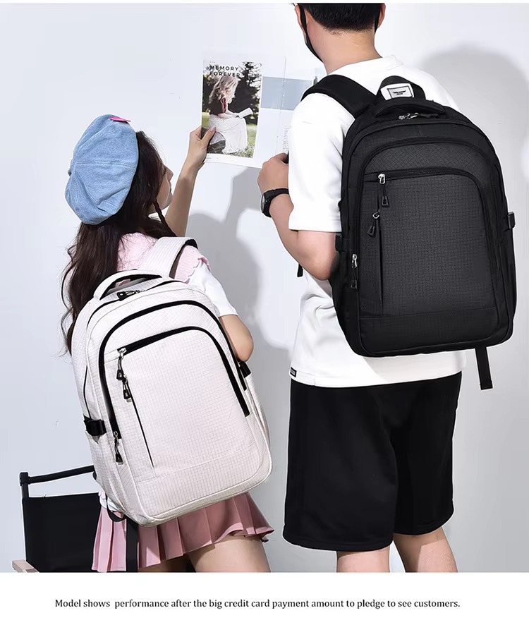 couple with white and black backpacks