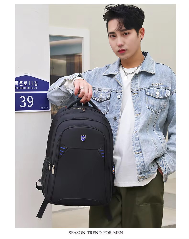 man holding blue accent backpack