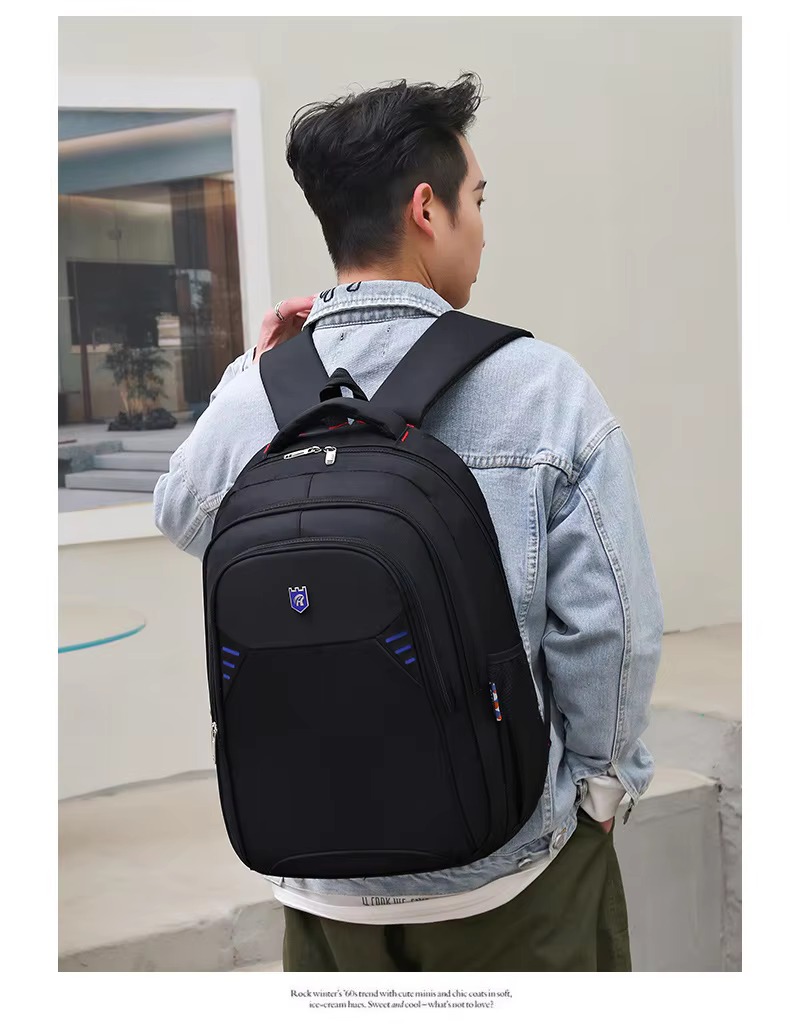 man wearing backpack back view