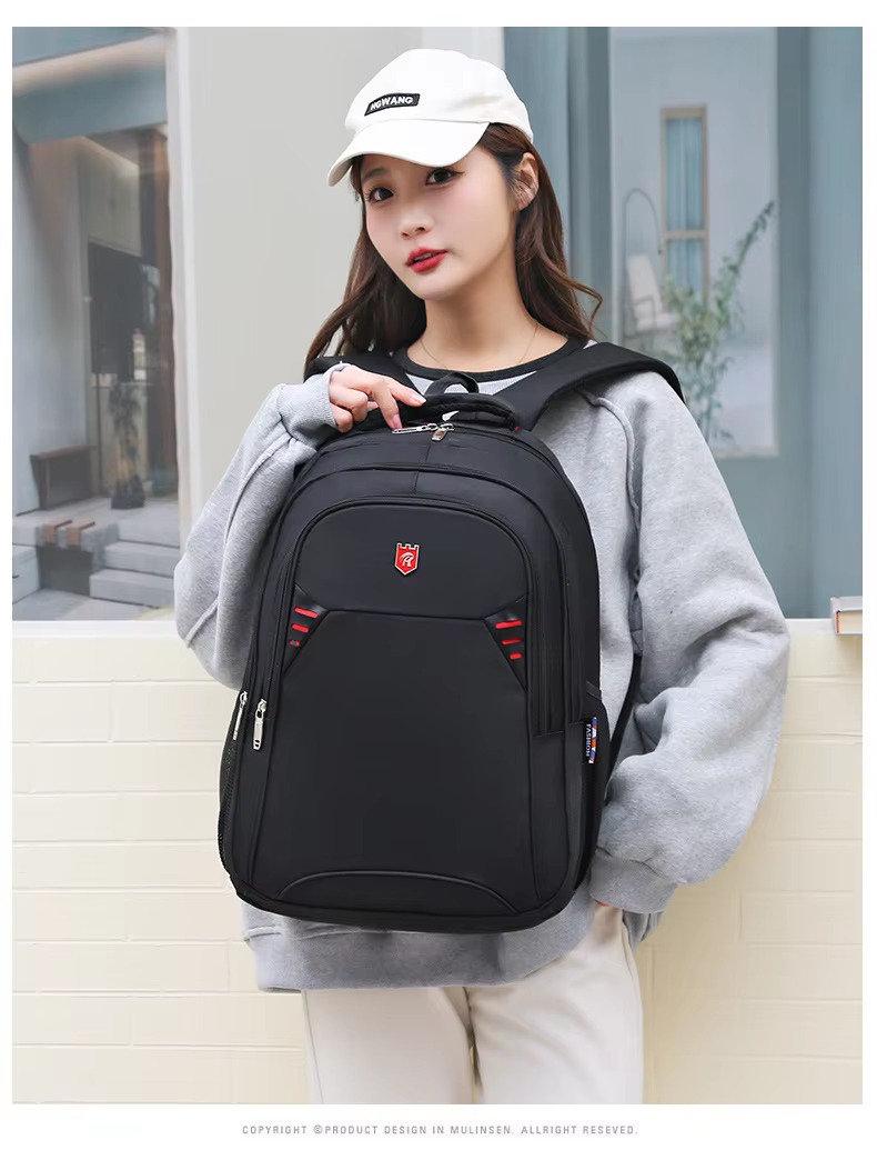 woman holding red accent backpack straps