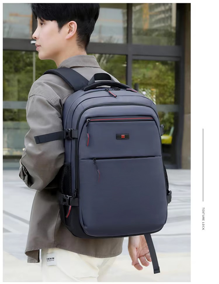 man wearing blue backpack side view