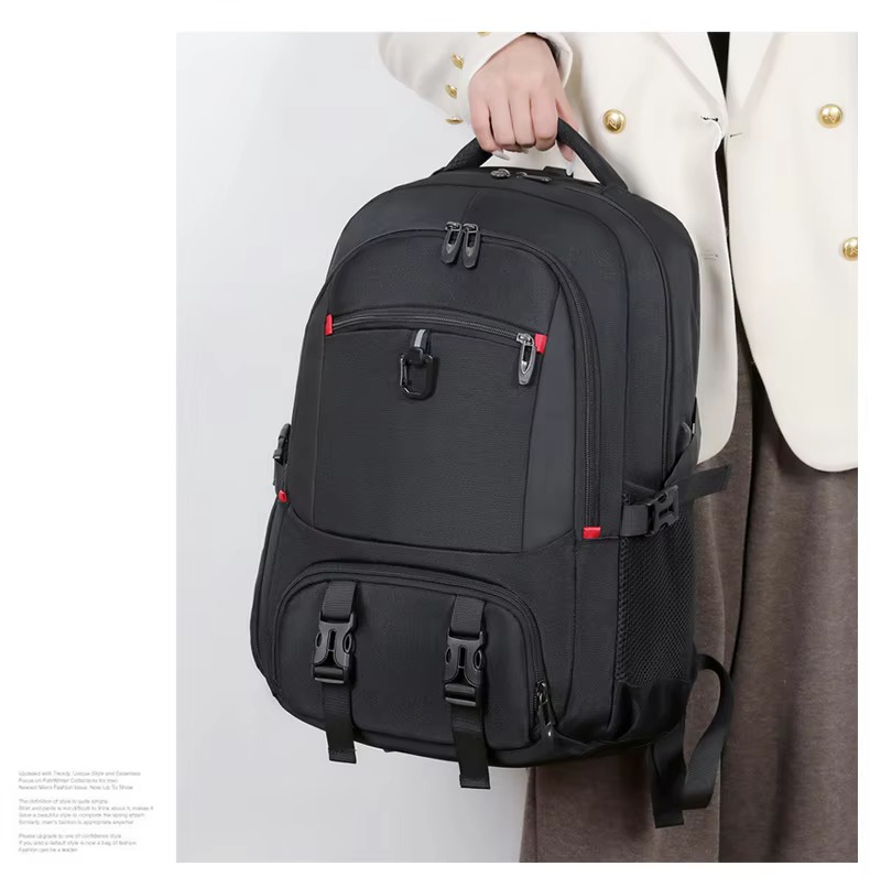 woman carrying black backpack by handle