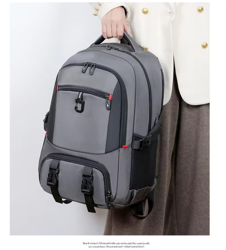 woman carrying gray backpack by handle