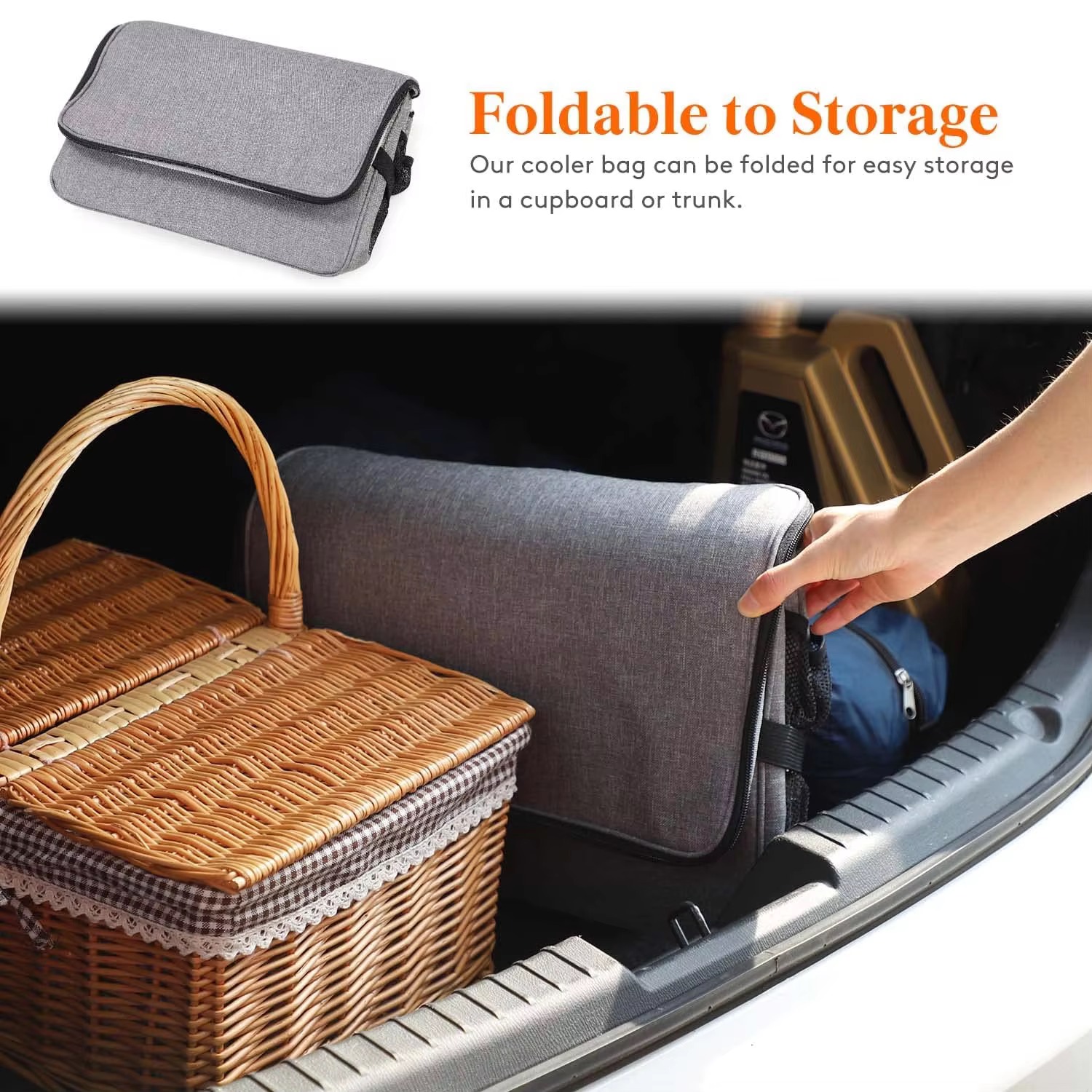 folded flat bag stored in car trunk beside a picnic basket