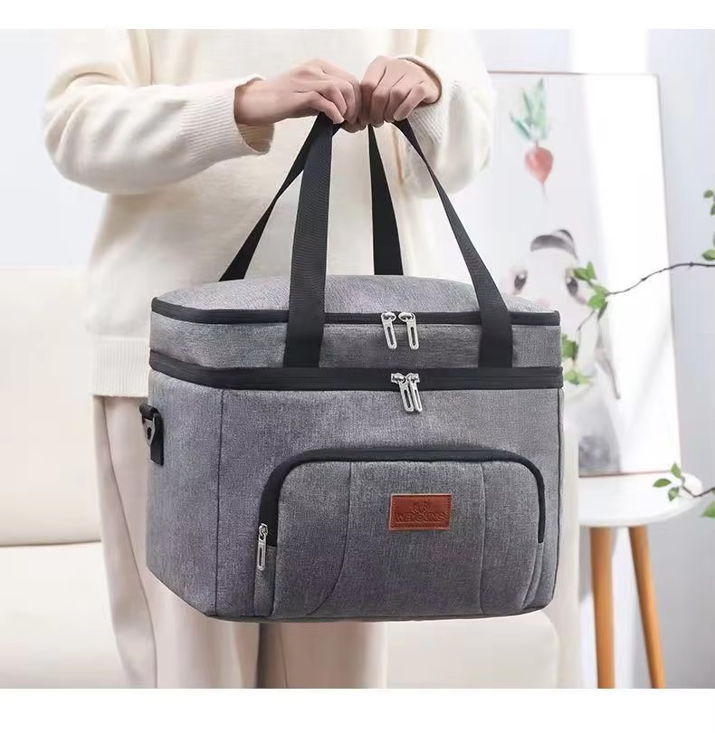 woman holding cooler bag by top handles