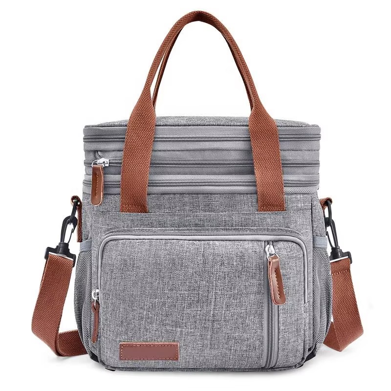 front three-quarter view showing handles front pocket and side strap