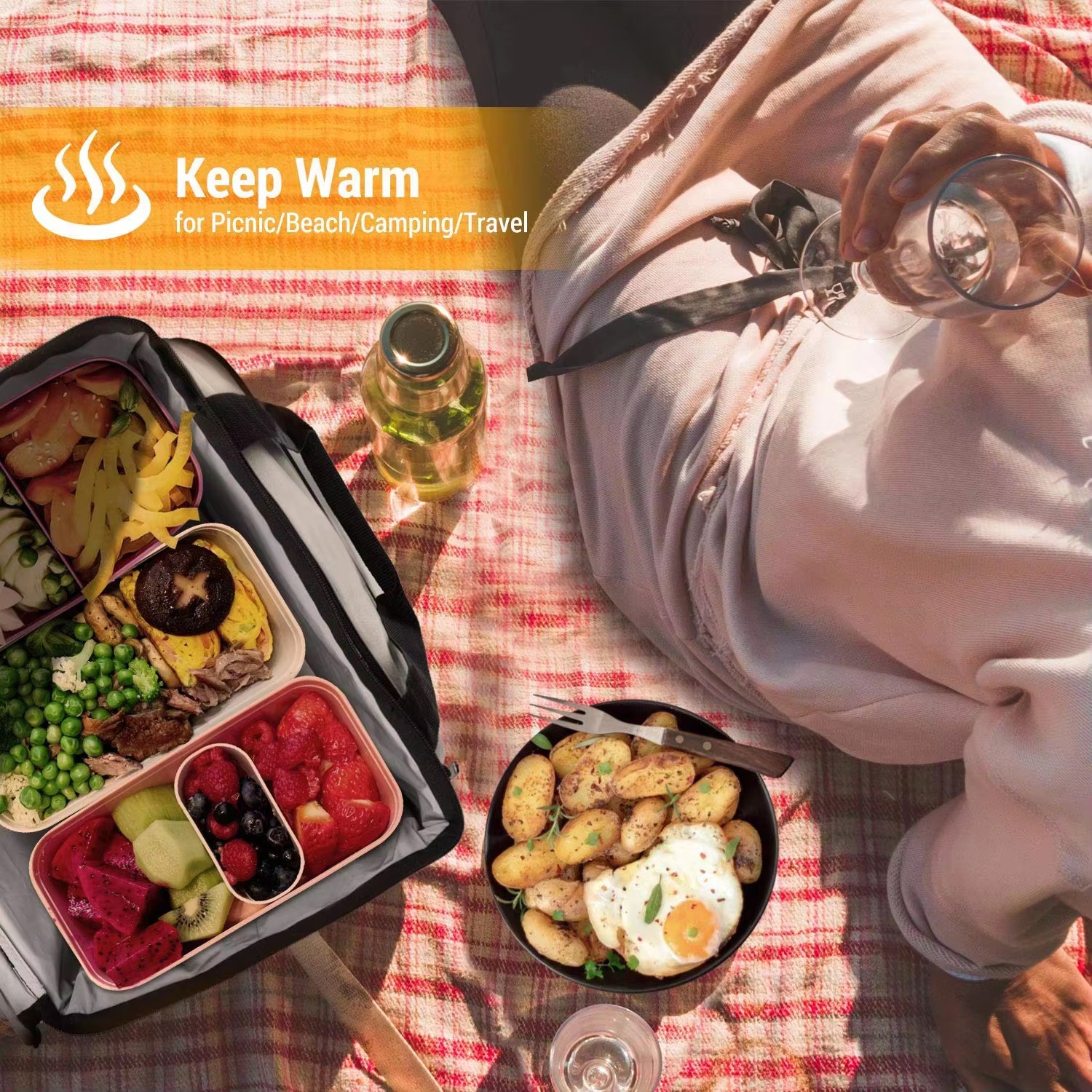 picnic scene with food containers kept warm on a blanket