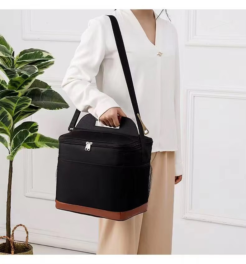 woman carrying cooler on shoulder