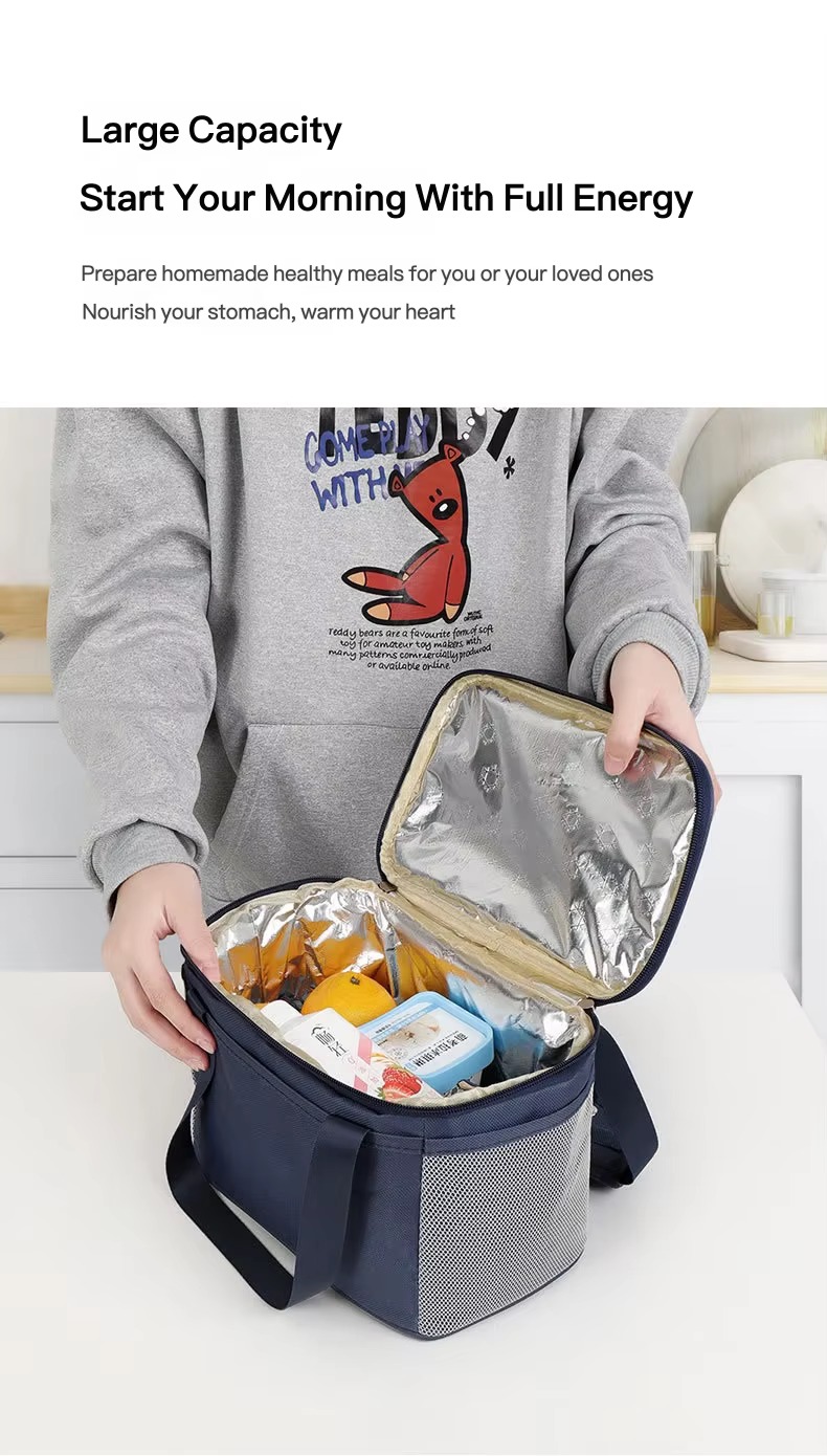 person packing food into open lunch bag