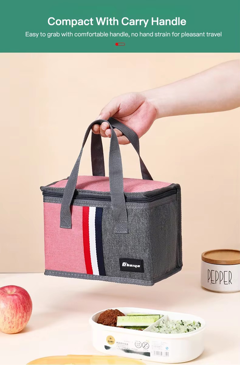 hand carrying pink lunch tote by handle