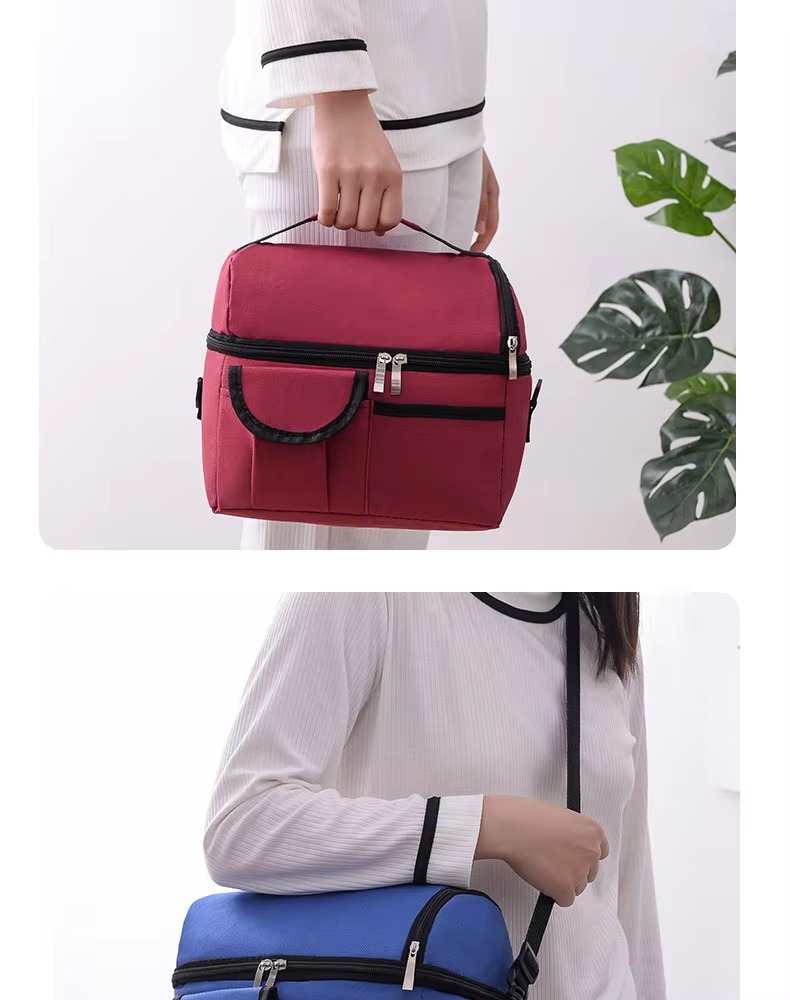 model carrying wine red bag by top handle