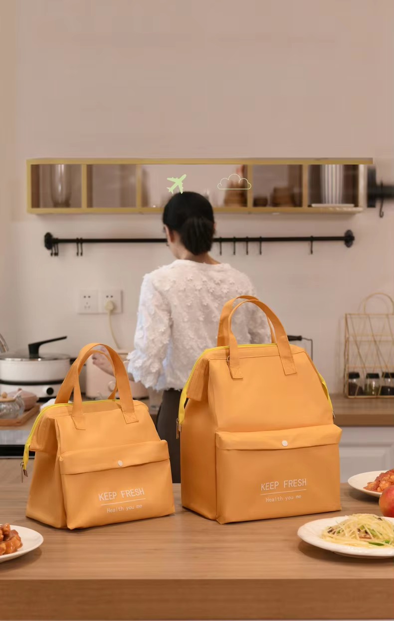 two orange lunch bags in kitchen