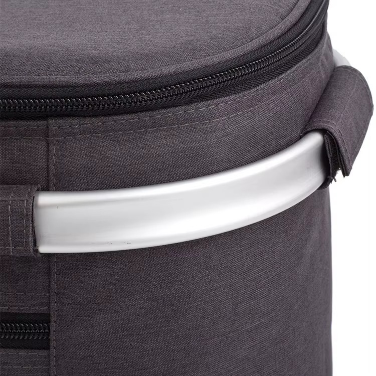 close-up of aluminum frame handle and zipper closure on top lid