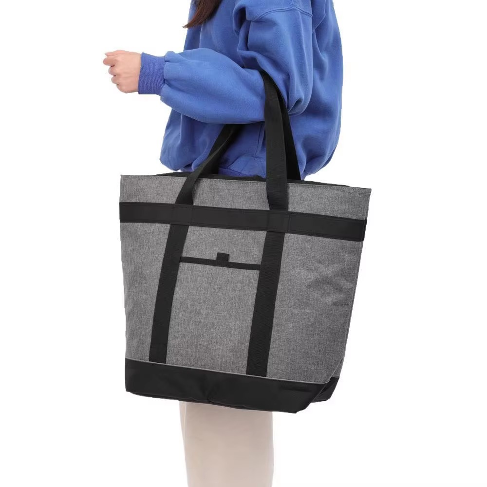 woman carrying cooler tote over shoulder