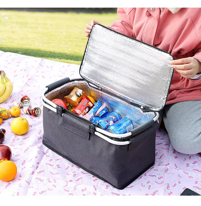 open basket showing thickened aluminum foil insulation liner and snacks